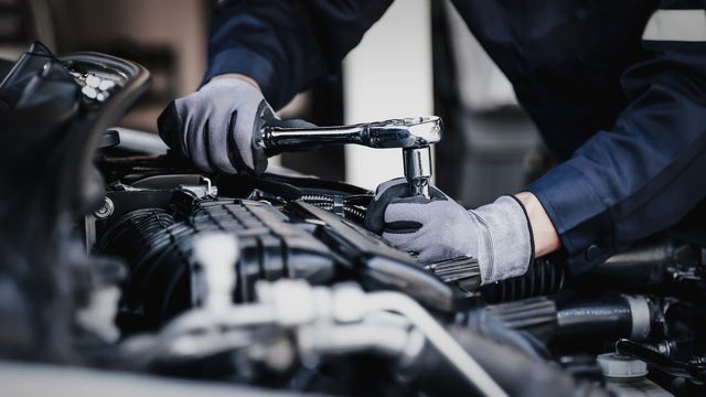 Technician working on an engine